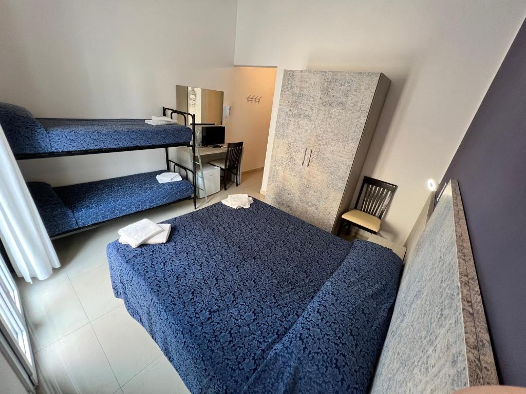 Postel nebo postele na pokoji v ubytování Club Vacanze In