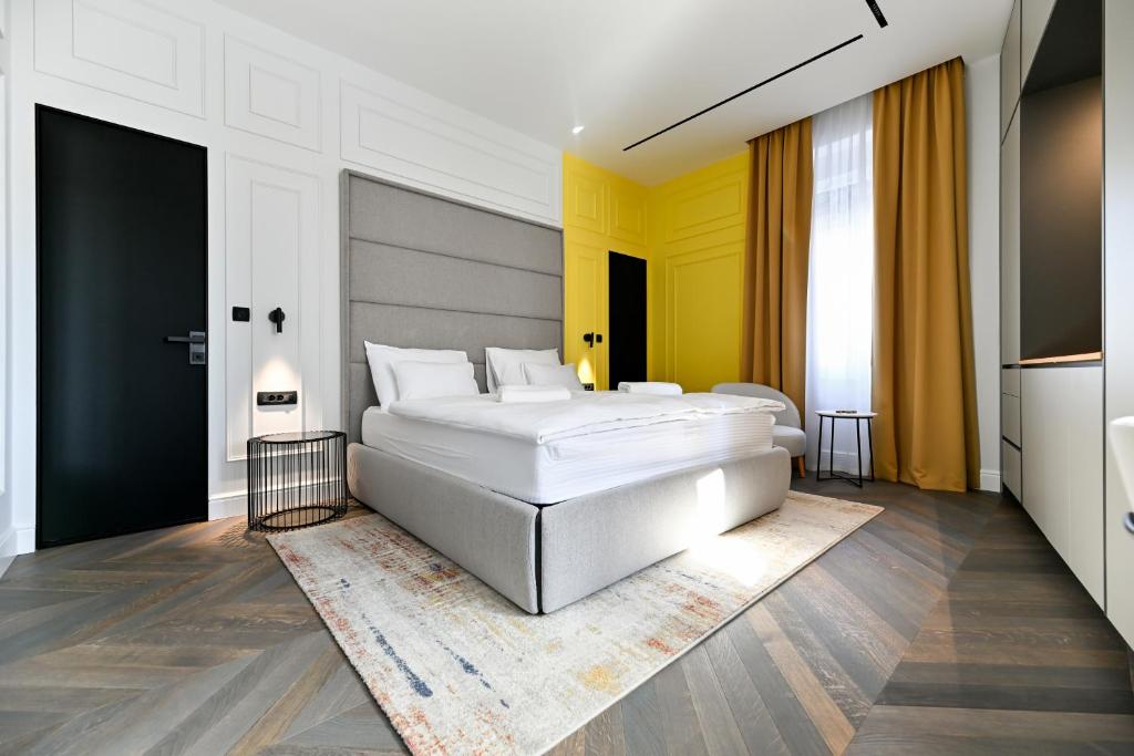 Postel nebo postele na pokoji v ubytování Three Pearls Deluxe Rooms & Studios