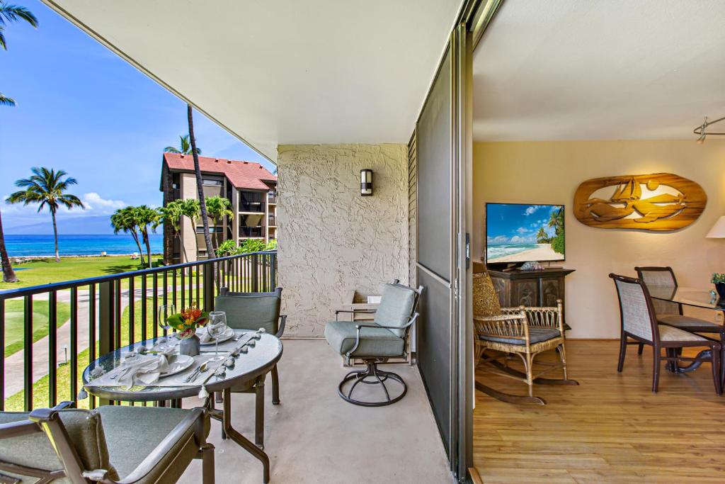 a balcony with a view of the ocean at Papakea B204 in Lahaina