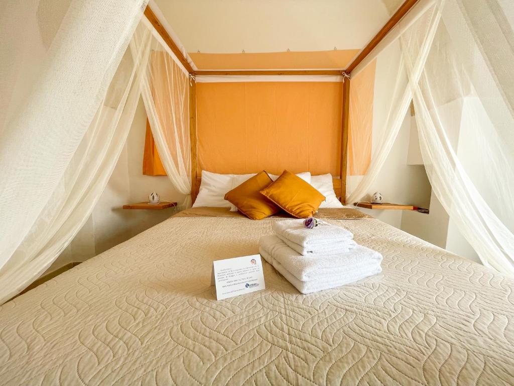 Postel nebo postele na pokoji v ubytování B&B Borgo Monacizzo