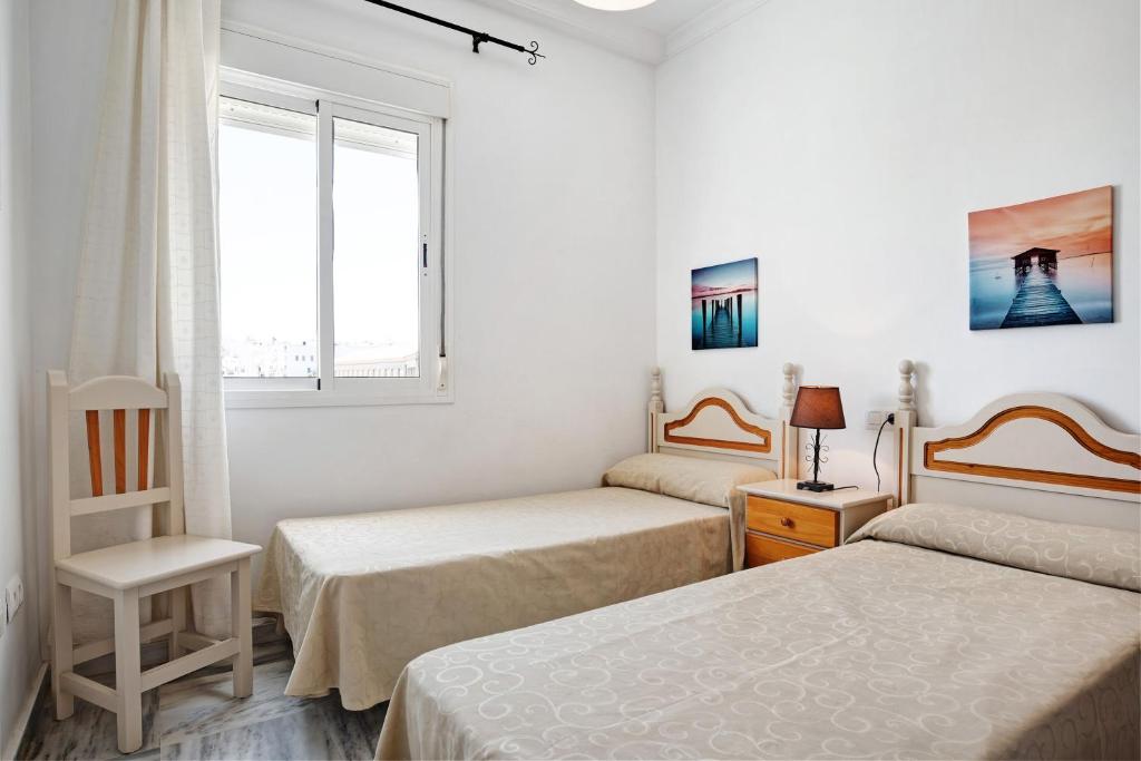 Posteľ alebo postele v izbe v ubytovaní Apartamento Atlántico 102