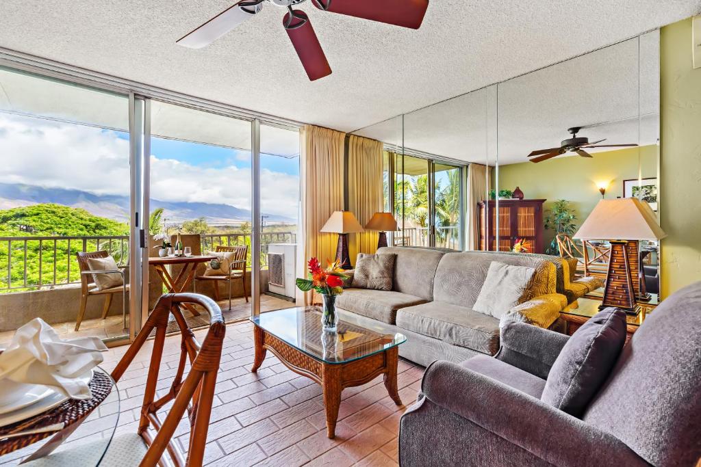 a living room with a couch and a table at Nani Kai Hale 404 in Kihei