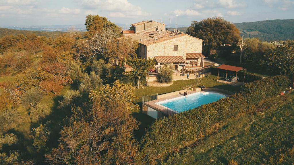 an aerial view of a house with a swimming pool at Holiday home Garetto in Chianni