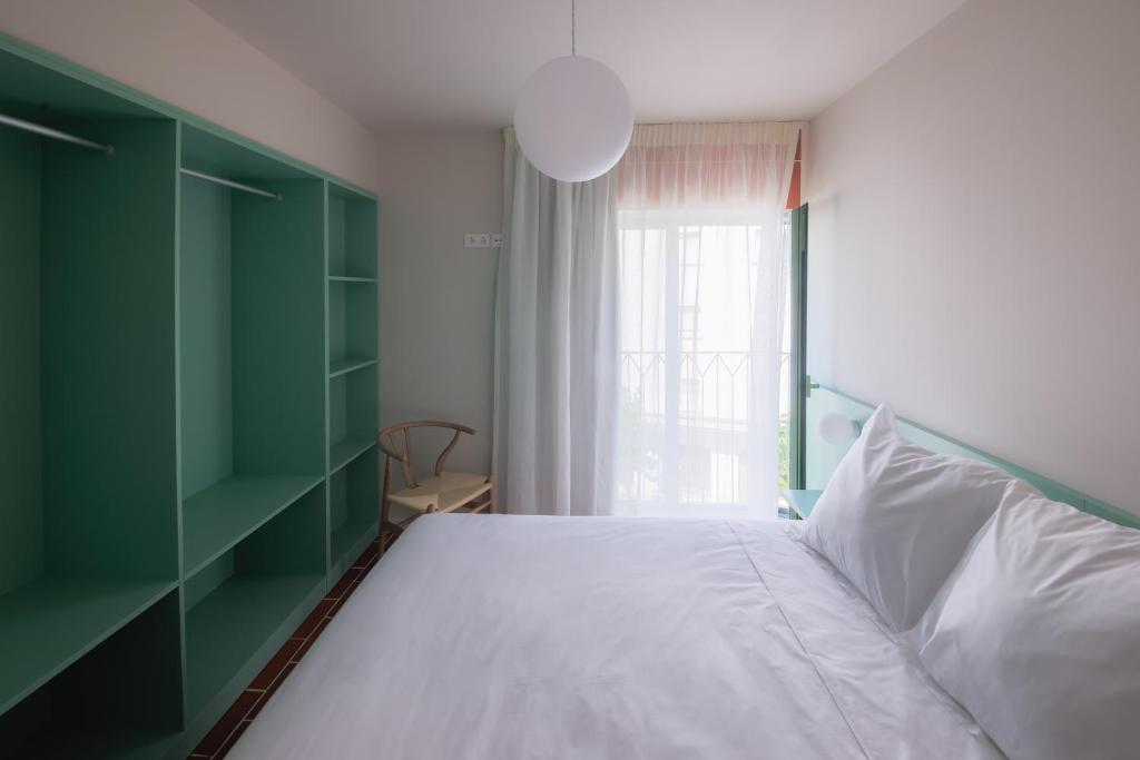 Postel nebo postele na pokoji v ubytování Terra Aurea Aparthotel