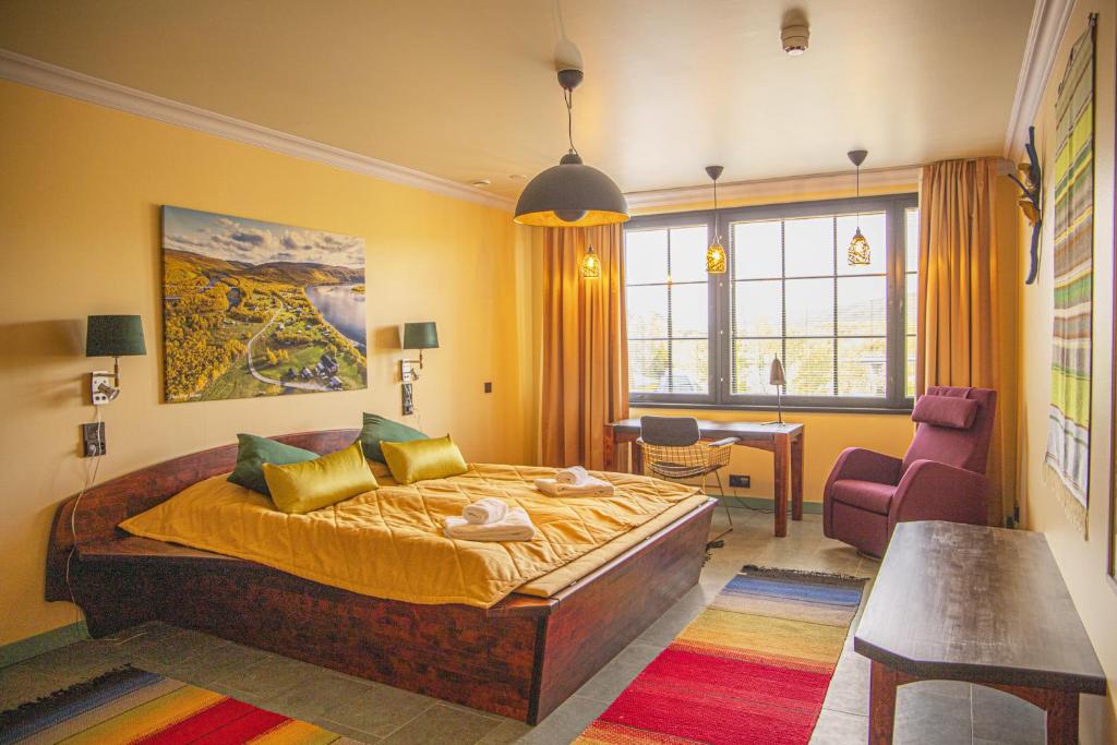 Postel nebo postele na pokoji v ubytování Utsjoki Arctic Resort