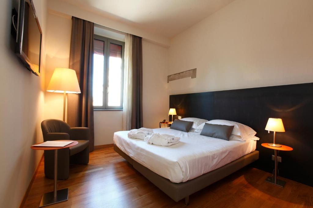 Postel nebo postele na pokoji v ubytování Hotel Annunziata