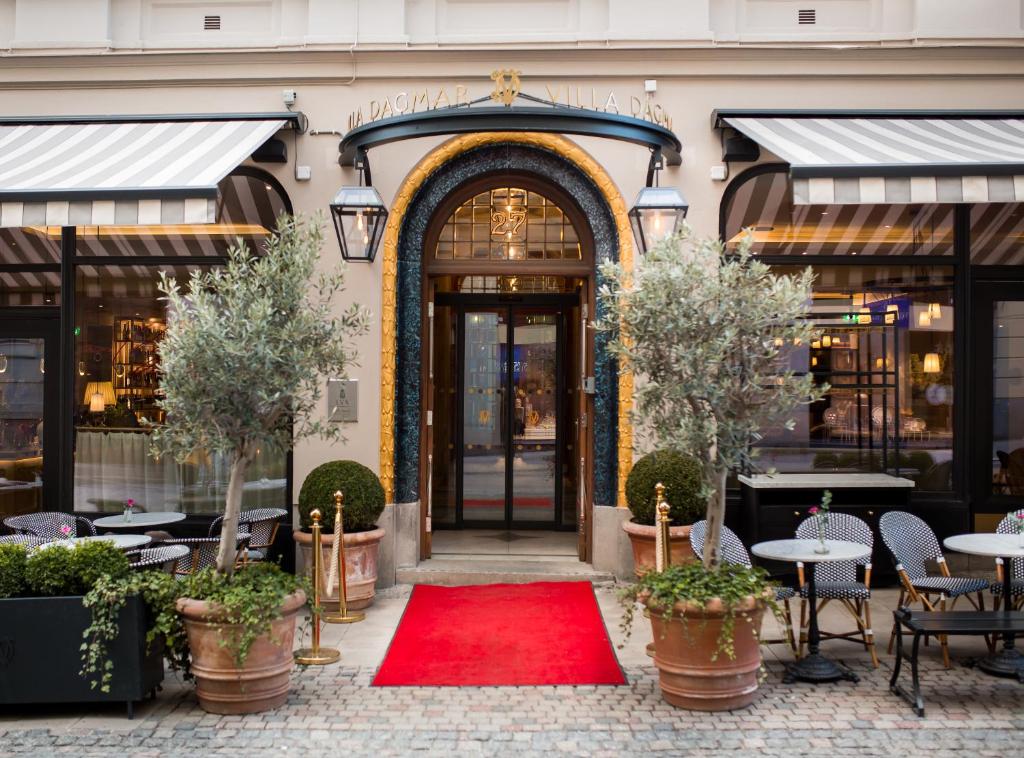 a red carpet in front of a building with a door at Villa Dagmar in Stockholm