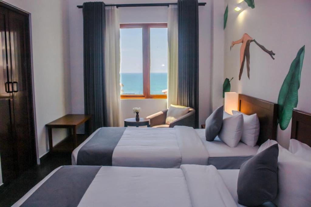 Postel nebo postele na pokoji v ubytování Morven Hotel Colombo