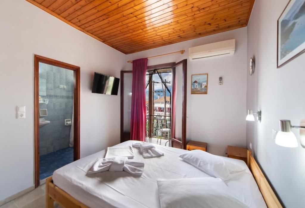 Postel nebo postele na pokoji v ubytování Hotel Nostos