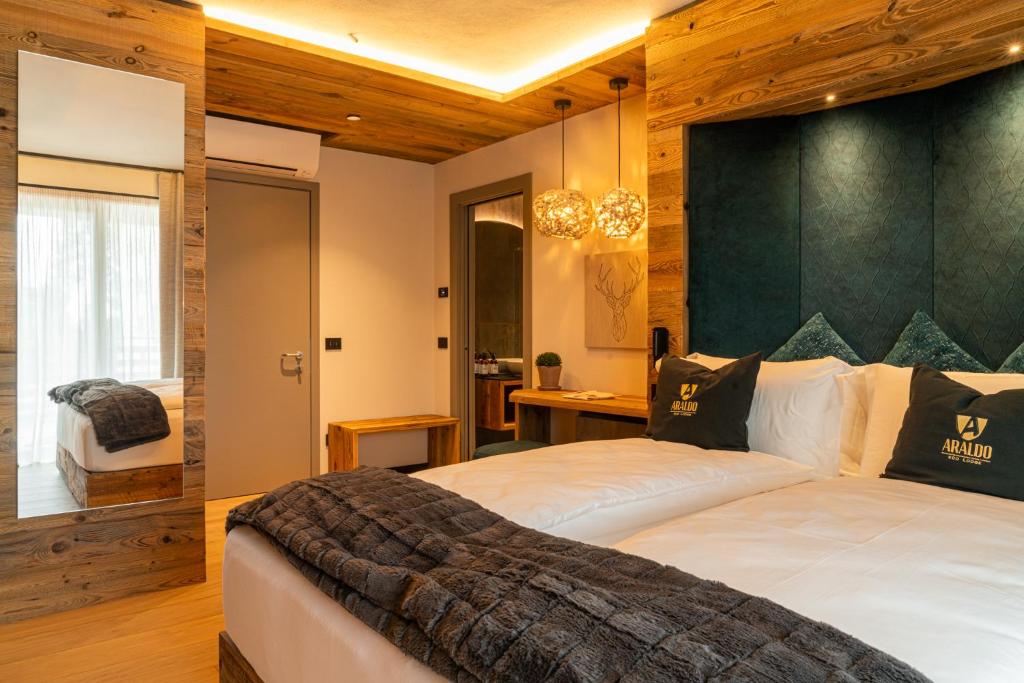 Postel nebo postele na pokoji v ubytování Araldo Eco-Lodge