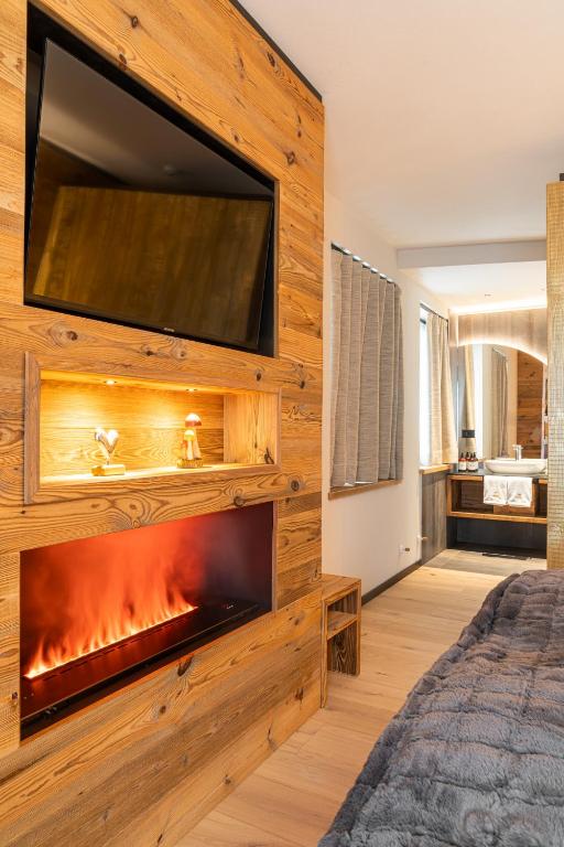 TV a/nebo společenská místnost v ubytování Araldo Eco-Lodge