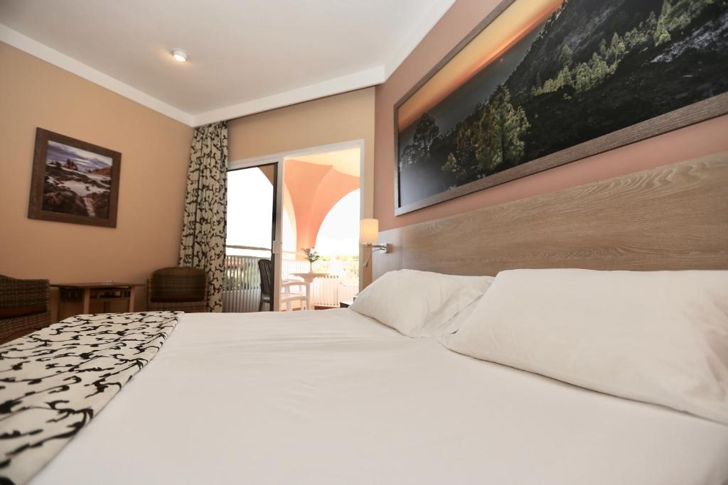 Postel nebo postele na pokoji v ubytování Hotel Puerto Palace