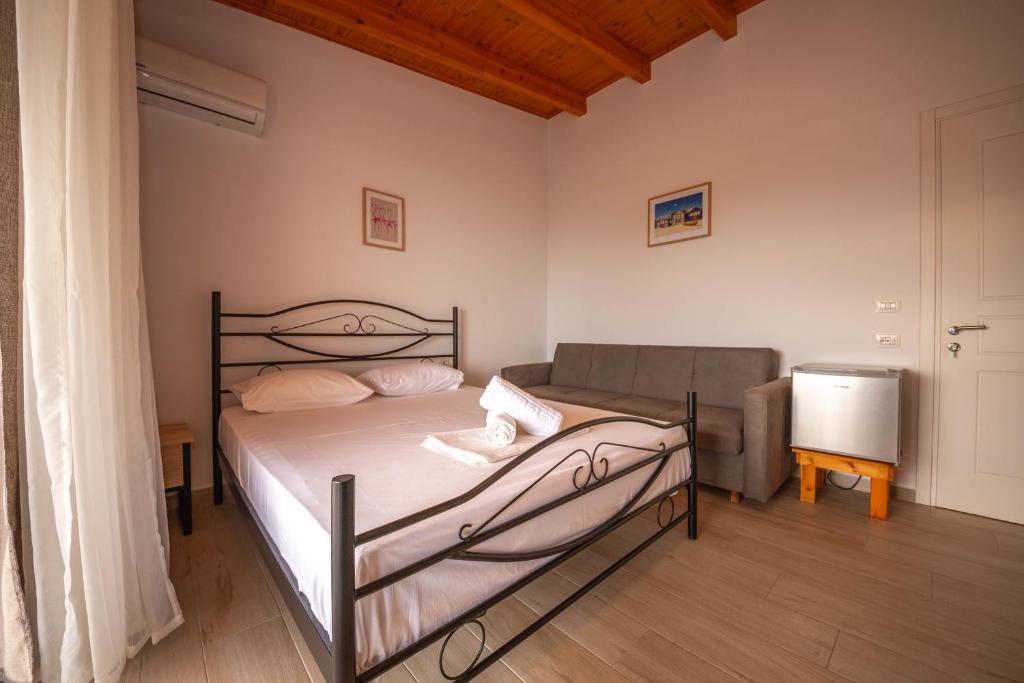 Postel nebo postele na pokoji v ubytování Villa Rondo