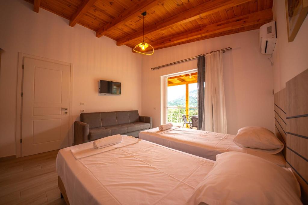 Postel nebo postele na pokoji v ubytování Villa Rondo