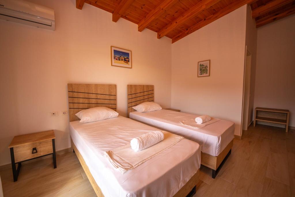 Postel nebo postele na pokoji v ubytování Villa Rondo