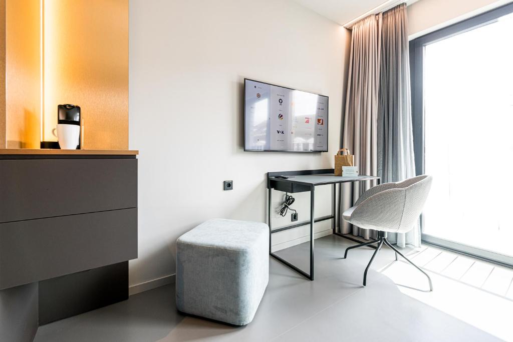 TV a/nebo společenská místnost v ubytování YUMA Apartments Leipzig Berliner Straße
