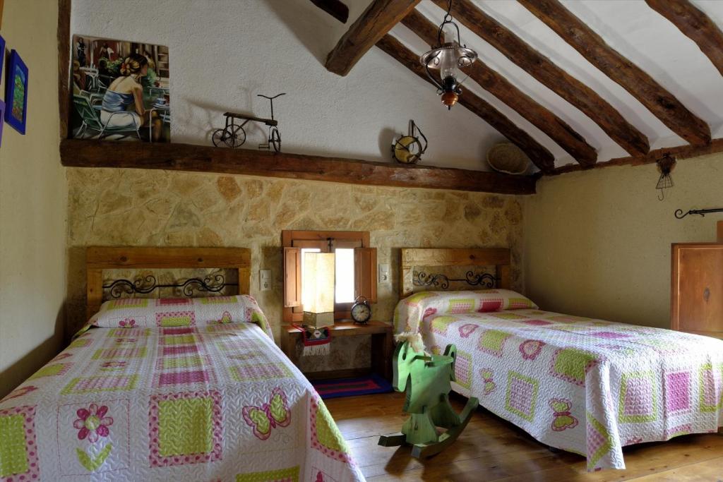 Postel nebo postele na pokoji v ubytování Casa Rural La Tahona