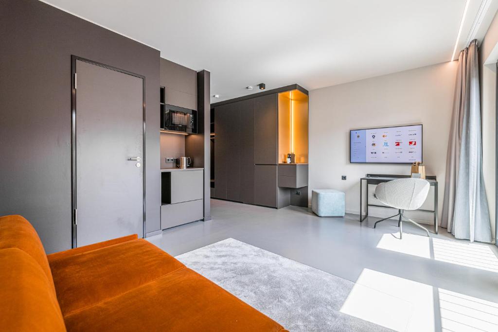 TV a/nebo společenská místnost v ubytování YUMA Apartments Leipzig Berliner Straße