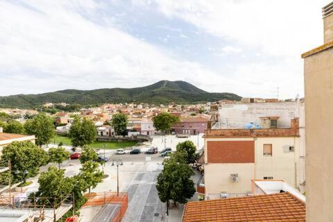 a view of a city with a mountain in the background at Teulada centro in Teulada