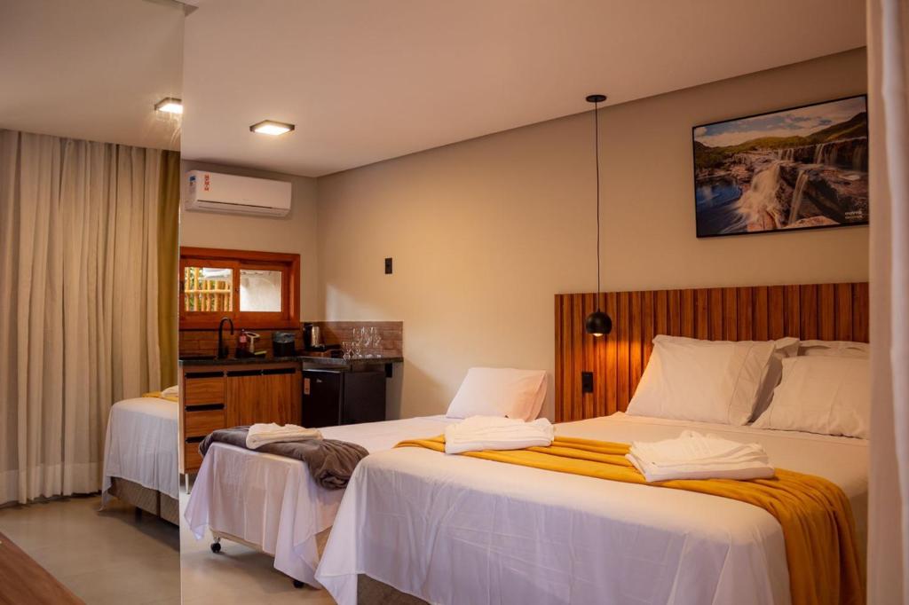 Ein Bett oder Betten in einem Zimmer der Unterkunft Vila Diamantina