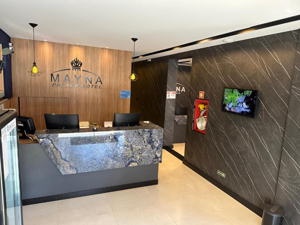 TV a/nebo společenská místnost v ubytování Mayná Hotel Prudentópolis Centro