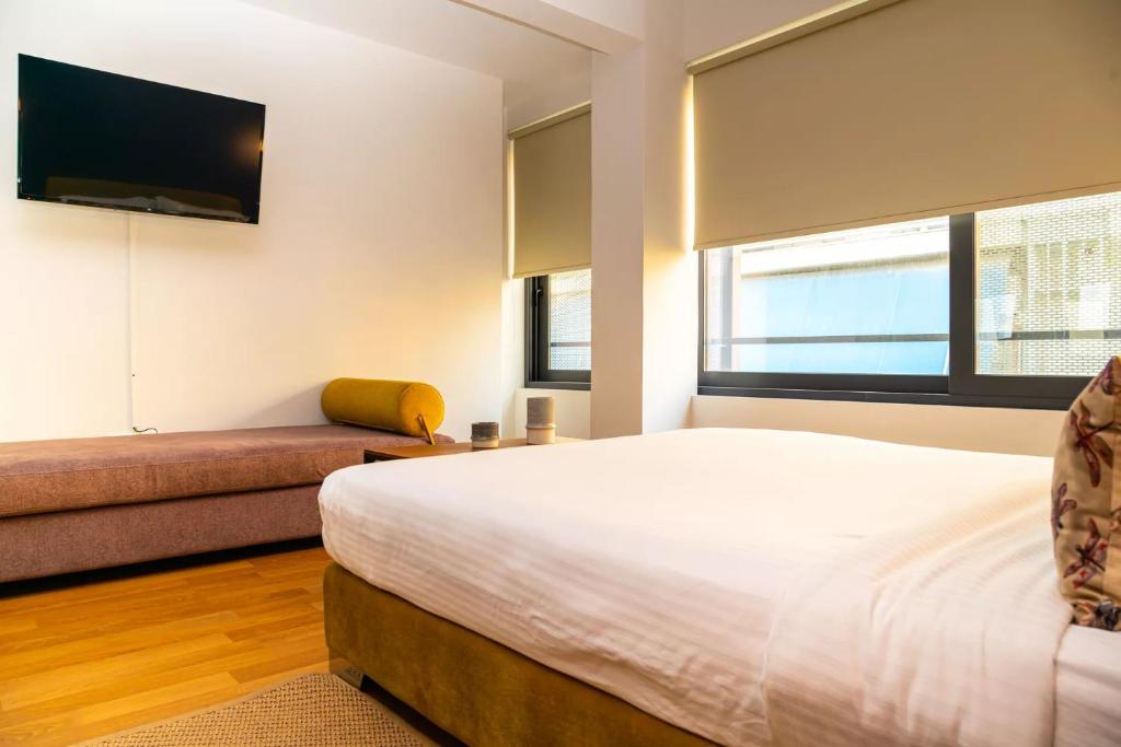 Postel nebo postele na pokoji v ubytování Iasonos Suites Athens