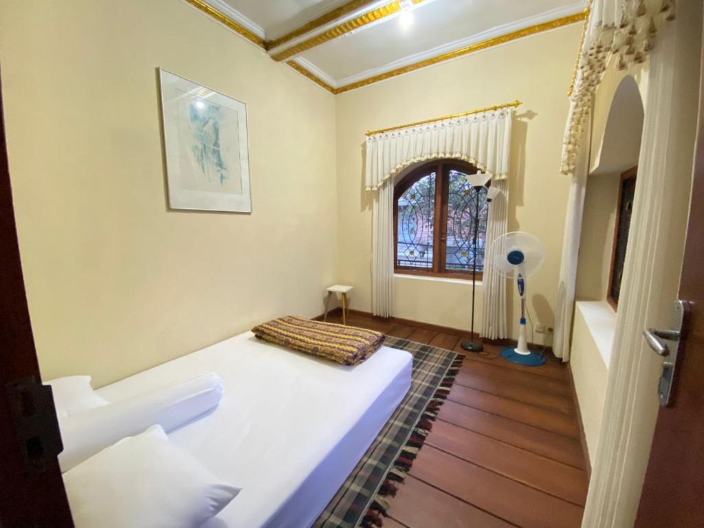 Ένα ή περισσότερα κρεβάτια σε δωμάτιο στο NN Homestay