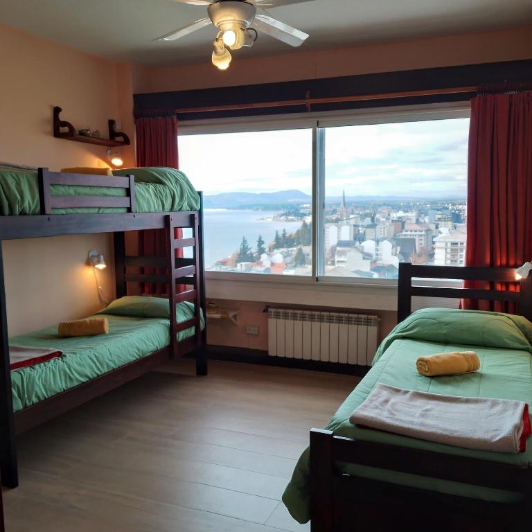 Postel nebo postele na pokoji v ubytování Hospedaje Penthouse 1004