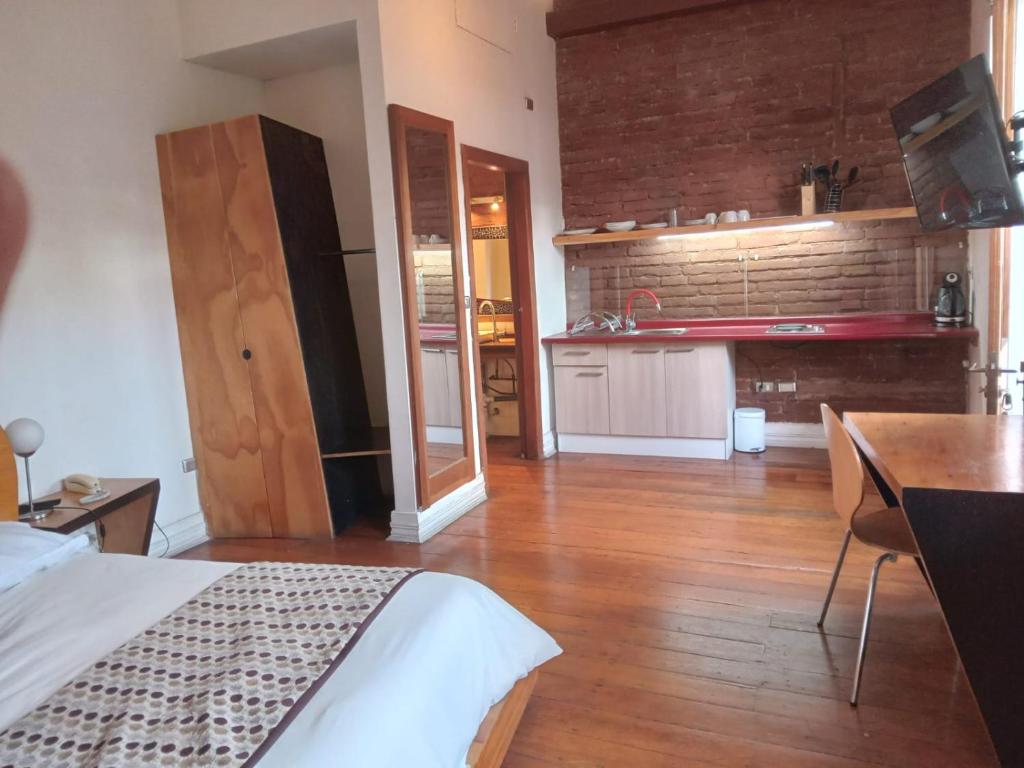 Kuchyň nebo kuchyňský kout v ubytování Hotel Latitud 33º Sur