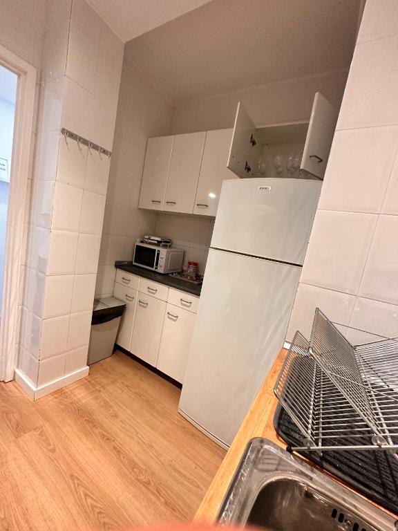 A kitchen or kitchenette at Plaza Spain Barcelona Apartments