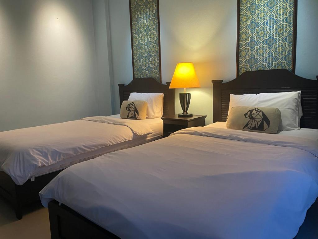 Postel nebo postele na pokoji v ubytování Mooz Huahin Bed & Breakfast