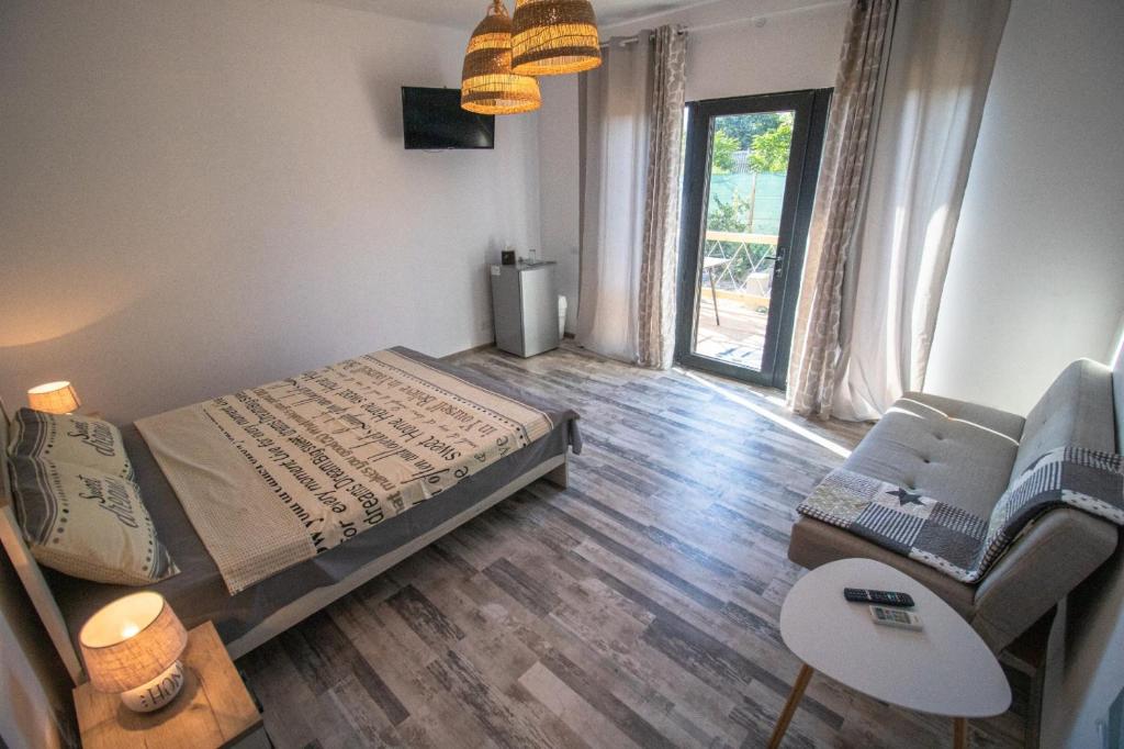 Postel nebo postele na pokoji v ubytování Flip Flop Bungalows