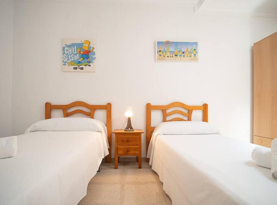 Postel nebo postele na pokoji v ubytování SibsSanlucar Albero - Ideal Familias - Centro - Playa Piletas
