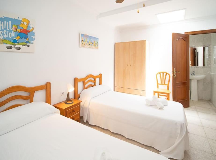 Postel nebo postele na pokoji v ubytování SibsSanlucar Albero - Ideal Familias - Centro - Playa Piletas