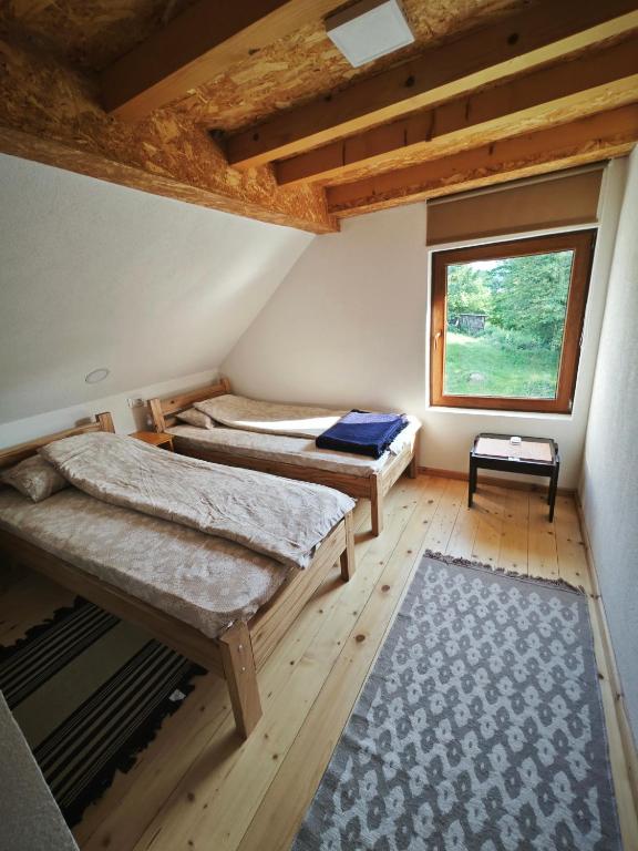 Postel nebo postele na pokoji v ubytování Mini Garden