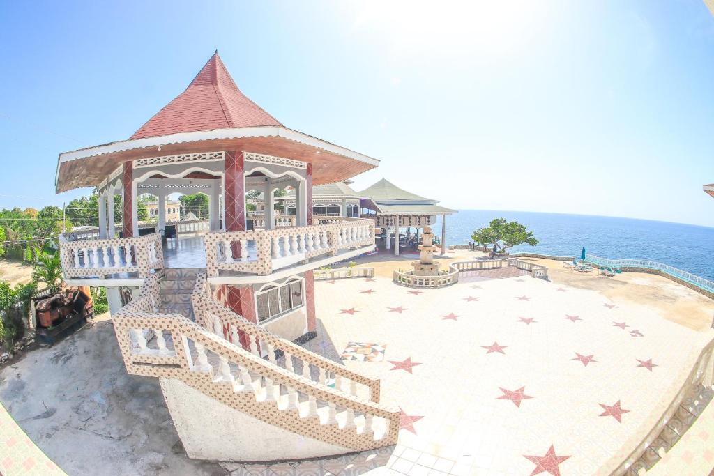 an aerial view of a gazebo on the beach at Kaiser Hotel- Negril West End in Negril