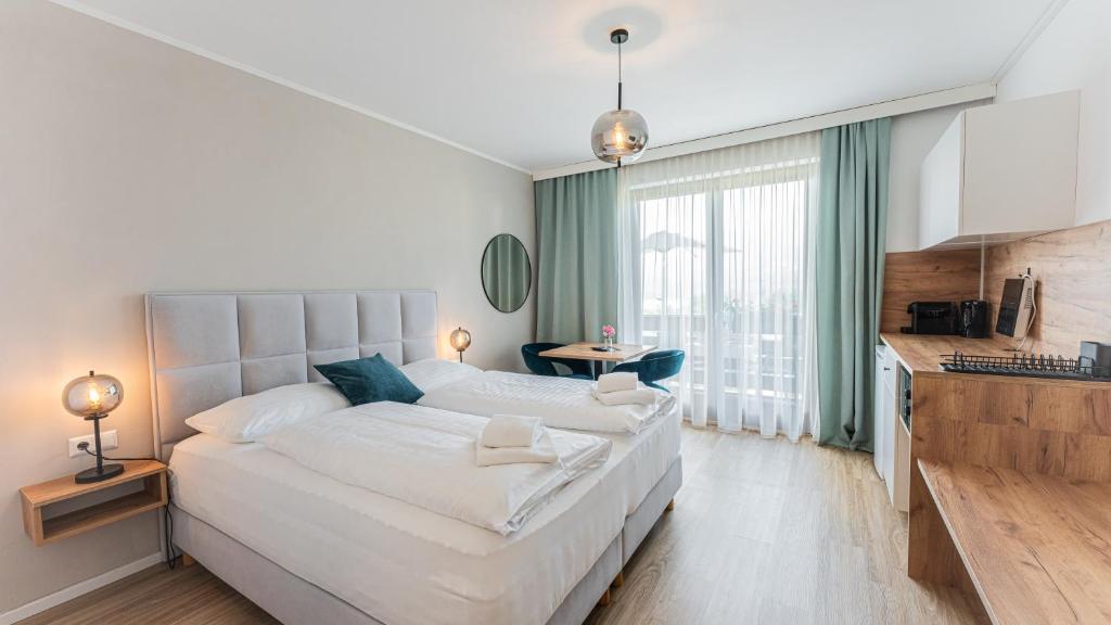Postel nebo postele na pokoji v ubytování Marienhof Apartments