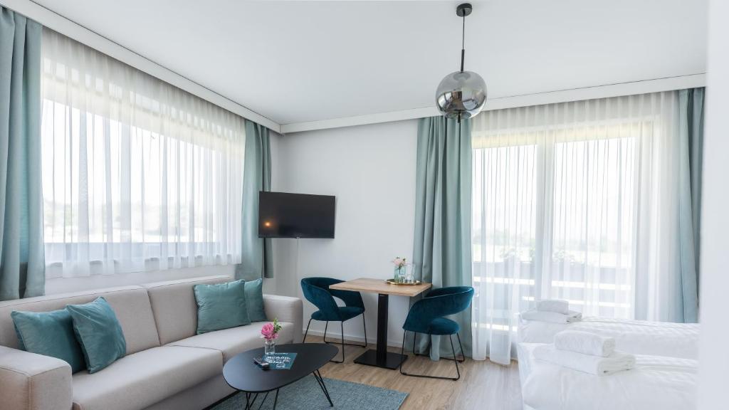 TV a/nebo společenská místnost v ubytování Marienhof Apartments