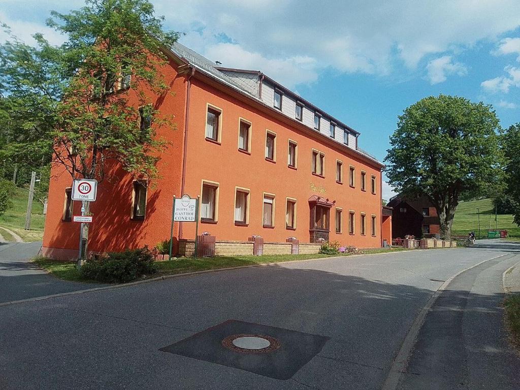 a large red brick building on the side of a street at Haus Gaia in Frauenstein