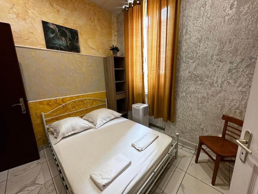 Postel nebo postele na pokoji v ubytování Hôtel Doré