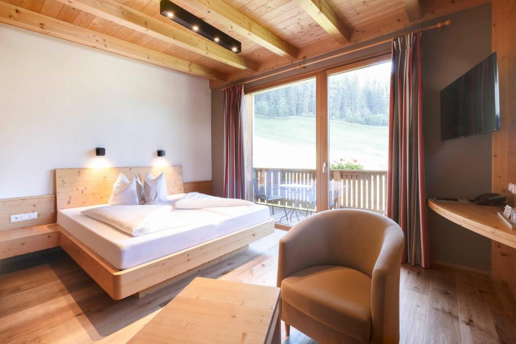 Postel nebo postele na pokoji v ubytování Pure PanoramaHotel Erika Superior