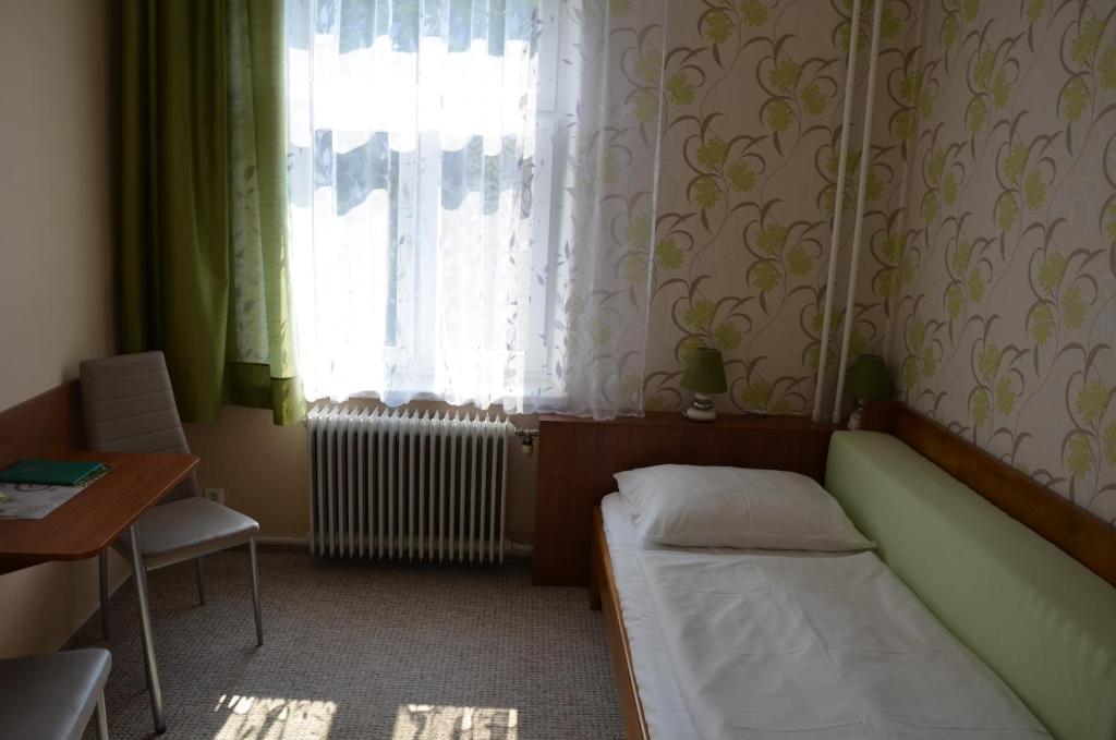 Postel nebo postele na pokoji v ubytování Penzion Ostravanka
