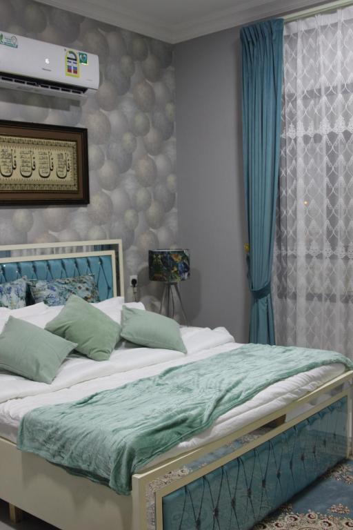 Кровать или кровати в номере آماسي و رواسي