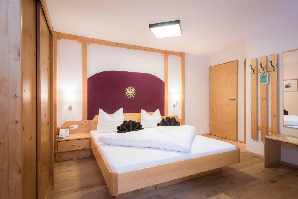 Postel nebo postele na pokoji v ubytování Pure PanoramaHotel Erika Superior
