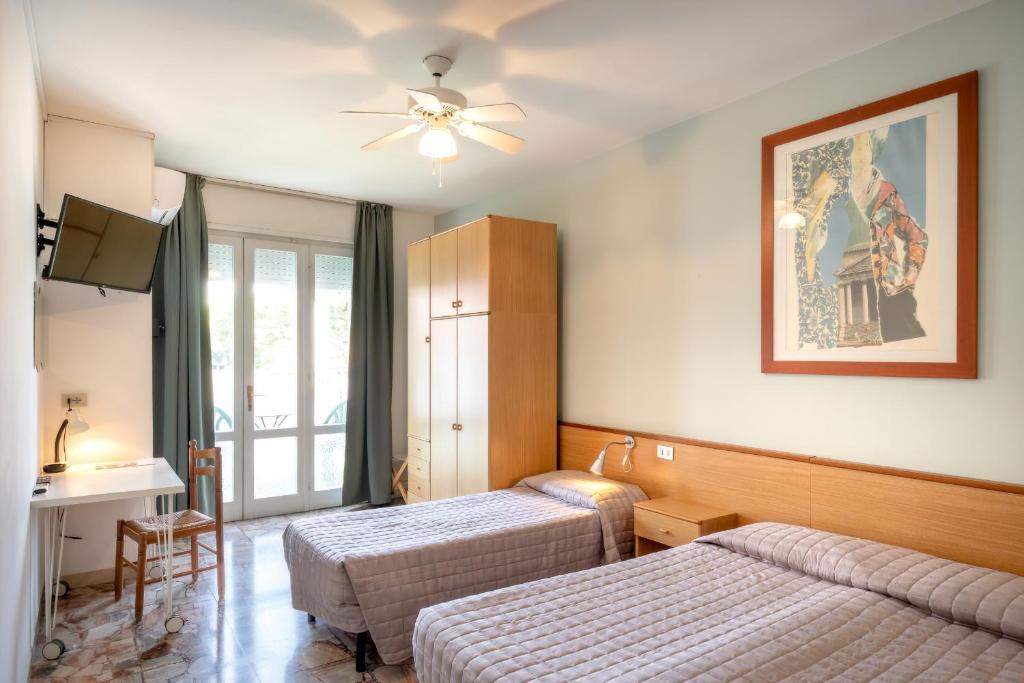 Postel nebo postele na pokoji v ubytování Hotel Itta