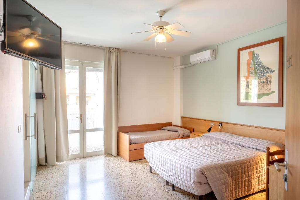 Postel nebo postele na pokoji v ubytování Hotel Itta