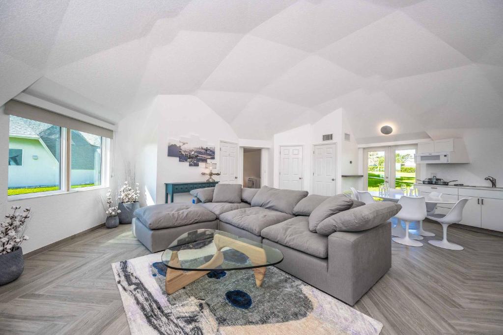 a living room with a couch and a table at Sumner Lake Tiny House in Clermont