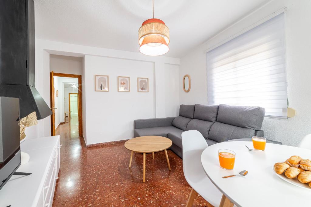 a living room with a couch and a table at Trendy Homes Zapillo I - Playa a 5 minutos andando in Almería