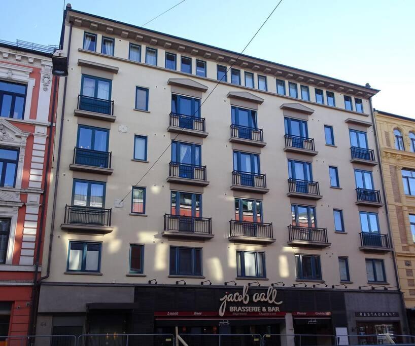 a large building with balconies on the side of it at Super-central and attractive Apartment in Oslo