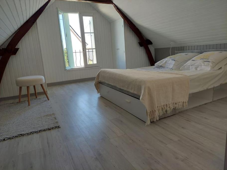 מיטה או מיטות בחדר ב-Le Cadran